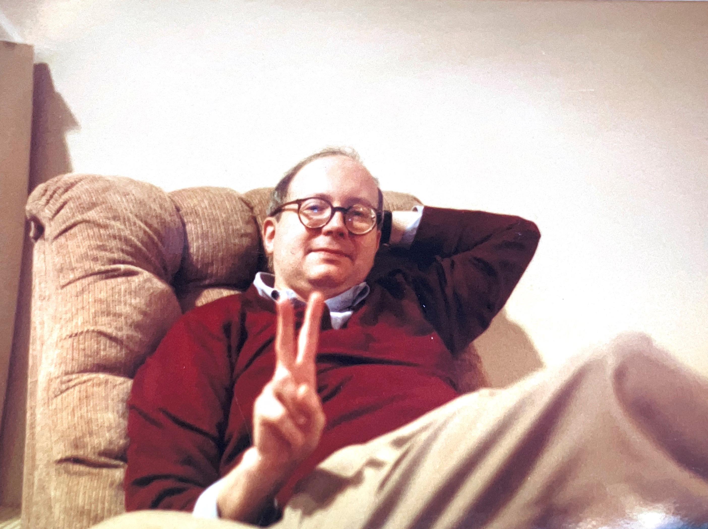 Stroup giving the peace sign. Photographer and location unknown.